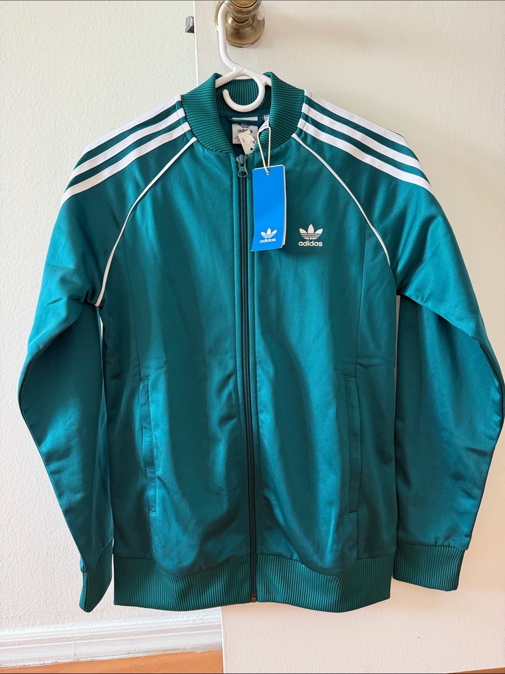adidas Teal Track Jacket with White 3-Stripes 
This is for kids not for men